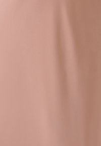 Smooth, soft fabric in a muted pink hue. The texture appears even, with no visible patterns or accents. Simple and minimalistic design.