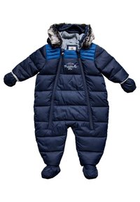 Mörkblå puffy sn overall med en huva med fuskpäls, blixtlås framtill och elastiska muddar. Har quiltat mönster och broderad text på bröstet.