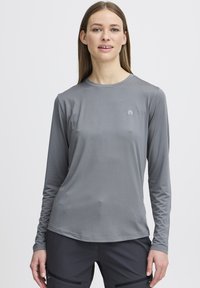 Lange mouwen sportshirt in mediumgrijs, gemaakt van een gladde, lichtgewicht stof. Voorzien van een ronde hals en een klein logo op de borst.