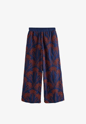 Navy wide-leg pants featuring an orange palm tree pattern. The fabric is lightweight with an elastic waistband for comfort.