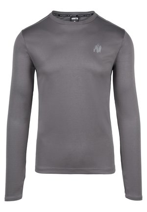 Siva dolgi rokav športna majica iz gladkega materiala, s krožnim ovratnikom in diskretnim logotipom na prsih.