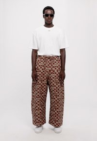 Henrik Vibskov ECLIPSE PANTS UNISEX - Püksid - beige/orange