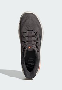 Gray athletic shoe with a mesh upper, wide fit, elastic laces, and orange accents. Features Cloudfoam cushioning for comfort.