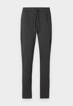 Pantalon de survêtement gris foncé avec une taille à cordon de serrage, des plis latéraux et une coupe fuselée. Tissu doux et texturé pour le confort.