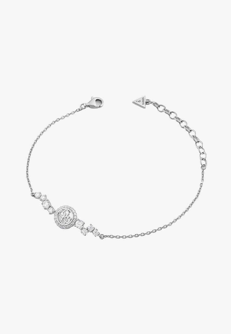Bracelet délicat en chaîne argentée avec un pendentif central rond à logo entouré de cristaux et un fermoir ajustable avec une étiquette de marque triangulaire.
