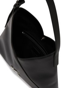 Black leather handbag with a wide shoulder strap, open top, and visible inner zippered pocket with a silver zipper pull.