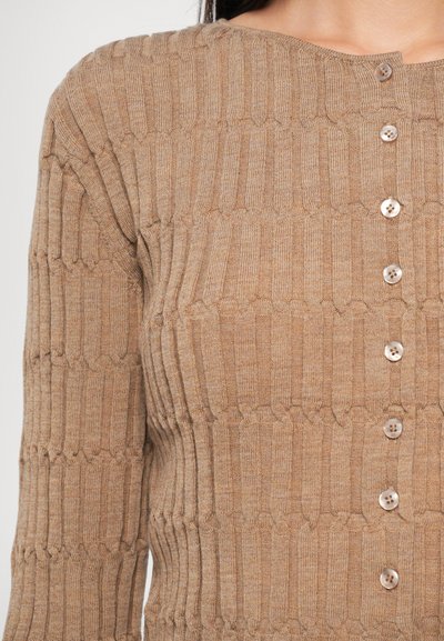 Brown, ribbed knit cardigan with a textured pattern, round neckline, and five buttons down the front. Soft, medium-weight fabric.