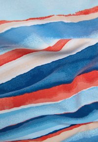Colorful striped fabric featuring horizontal lines in shades of blue, red, cream, and peach. Soft, textured, and lightweight material.