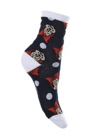 Calcetines negros con un diseño de lunares blancos, presentando un patrón repetido de un personaje con un lazo rojo. El material parece elástico.