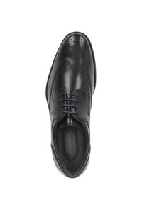 Scarpa da uomo in pelle nera con finitura liscia, dettagli brogue sulla punta e sei occhielli per i lacci. Forma leggermente curva.