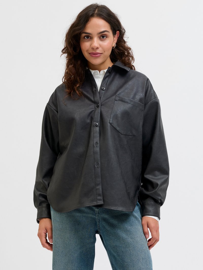 Black faux leather shirt with a collared neckline, front pocket, and button closure. Long sleeves, relaxed fit, and smooth texture.