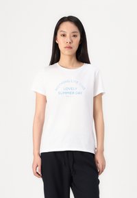 White cotton t-shirt with short sleeves, featuring blue text that reads "NOTHING LIKE THIS LOVELY SUMMER DAY" in an arched design.