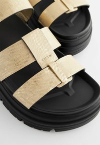 Next Täistallaga sandaalid - gold textured