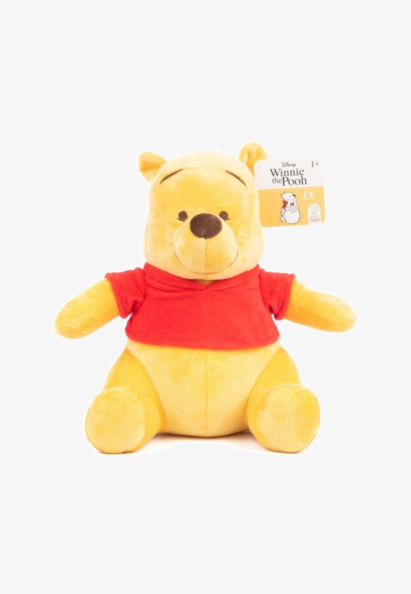 Pluche speelgoed, Winnie de Poeh. Geel pluche lichaam met een zachte textuur, rode shirt, rond gezicht, geborduurde ogen, en een hangtag aan de zijkant.