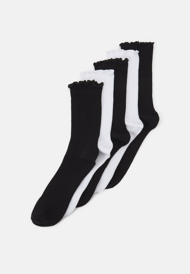 Five pairs of knee-high socks in black and white. The socks feature a ribbed texture and a ruffled cuff detail along the top.