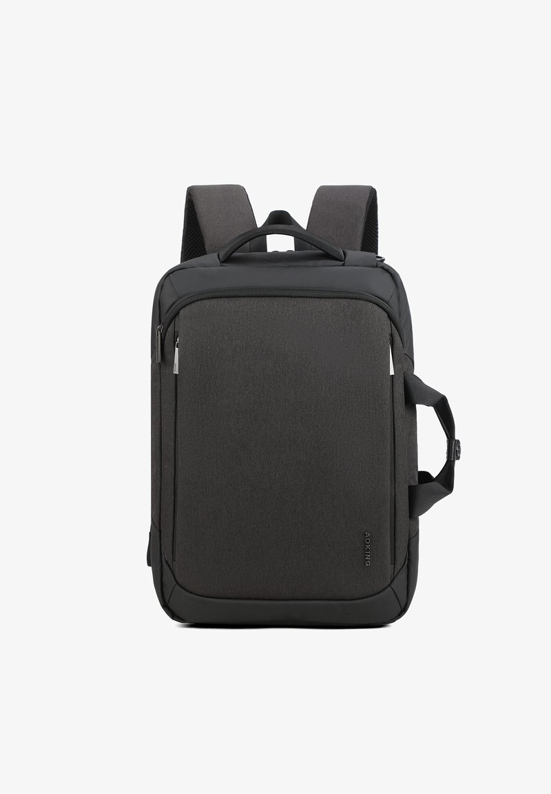 Sac à dos noir avec un tissu texturé, comprenant une poche zippée à l'avant, des bretelles rembourrées et une poignée supérieure pour le porter.