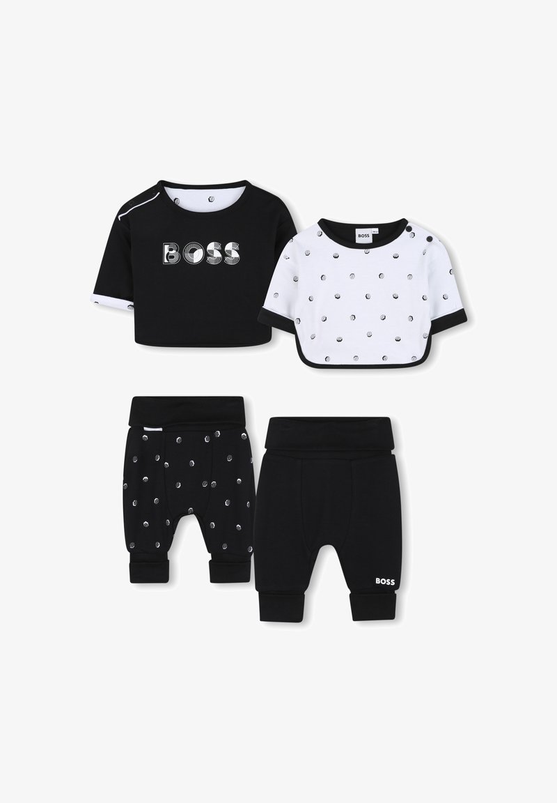 Deux ensembles de vêtements pour enfants : un haut noir à manches courtes avec le logo 'BOSS', un haut blanc à pois et un pantalon noir avec un motif de pois argentés.