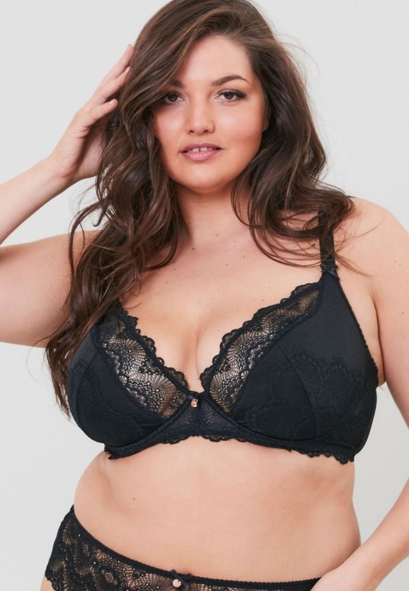 Mustat pitsitoppi, jossa on kukkakuvio, syvä pääntie, säädettävät hihnat ja koristeellinen ruusukultainen yksityiskohta keskellä.