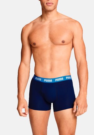 Navy blue boxer shorts made of soft fabric with a light blue Puma logo waistband. Features a fitted design for comfort and support.
