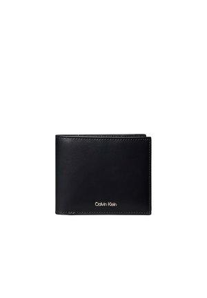 Portafoglio bi-fold in pelle nera con cuciture visibili e piccolo logo Calvin Klein in argento al centro frontale.