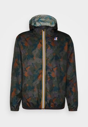Hooded lightweight jacket with green, brown, and dark blue camouflage pattern and a central zipper with yellow, white, and navy stripes.