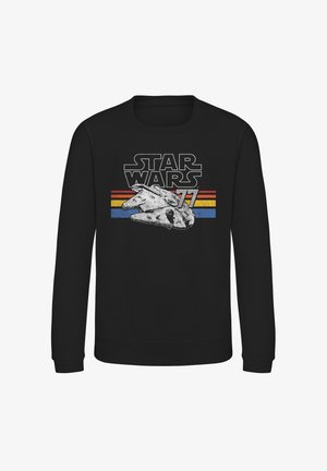 Sweatshirt noir portant "STAR WARS 77" en lettres grasses, avec un graphique du Millennium Falcon et des bandes colorées horizontales (rouge, jaune, bleu).