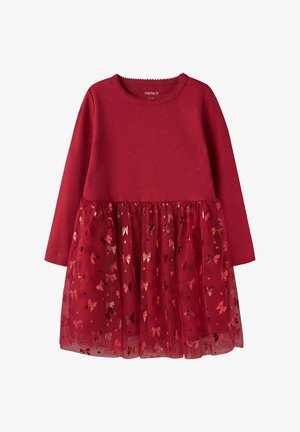 Rotes langärmliges Kleid mit einem gerippten Oberteil und einem Tüllrock, der metallische Schleifenmuster und verstreute Glitzerpartikel aufweist.