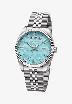 Montre en acier inoxydable argenté avec un cadran texturé bleu-vert, des index horaires argentés et un affichage de la date. Elle est dotée d'un bracelet à maillons métalliques et d'une lunette cannelée.