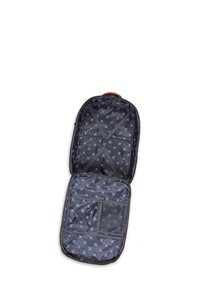 Intérieur de valise en textile noir avec un revêtement à motifs. Comprend des fermetures éclair, des sangles réglables et une poche en mesh pour l'organisation.