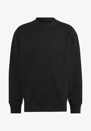 Sweat-shirt noir en coton, col rond, poignets et ourlet côtelés, avec un petit logo ton sur ton sur la poitrine. Style simple et décontracté.
