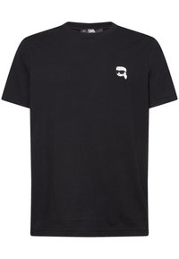 T-shirt in cotone nero con girocollo, maniche corte e un piccolo logo bianco sul petto sinistro. Texture liscia e vestibilità classica.