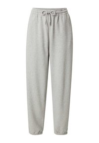 Lichtgrijze sweatpants van zachte stof, met een verstelbare tailleband en elastische manchetten bij de enkels. Eenvoudig ontwerp zonder patronen.
