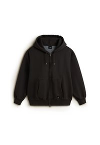 Schwarze Zip-Hoodie aus weichem Stoff mit einer Vorderstasche, Kapuze mit Kordelzug und gerippten Bündchen. Logo-Patch auf der unteren linken Seite.