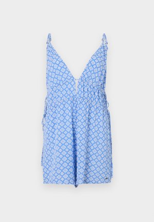 Blue patterned romper with a deep V-neck design, adjustable straps, and a gathered waist. Features white geometric patterns throughout.