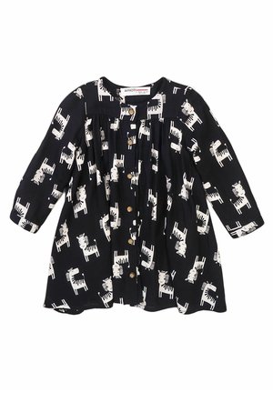 Bawełniana sukienka na granatowym tle, z białym wzorem zebry, z zapięciem na guziki oraz długimi rękawami z marszczeniami.