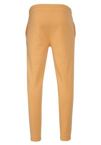 Karl Kani REGULAR FIT - Joggebukse - apricot