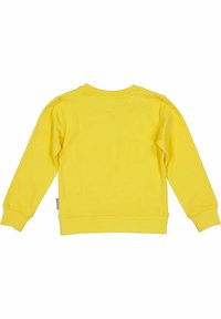 Gul sweatshirt med långa ärmar och ribbade muddarna. Slät textur och design med rundad halsringning, med en liten varumärkesetikett på sidan.