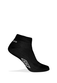 Chaussette noire à la cheville en matière lisse avec un bord côtelé. Présente un logo sur le côté et un motif en forme de diamant blanc sur la semelle.