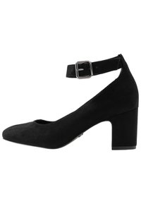 Punta nera in suede con tacco a blocco, cinturino alla caviglia e fibbia in metallo, caratterizzata da una punta arrotondata e una superficie liscia, progettata per il comfort.