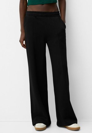 WIDE FUZZY  - Tracksuit bottoms - black