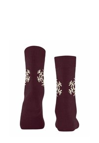Bordowe skarpetki z białymi wzorami w śnieżynki. Rybaczki na mankietach. Miękka tekstura, wysokość do kostki. Odpowiednie na zimową pogodę.