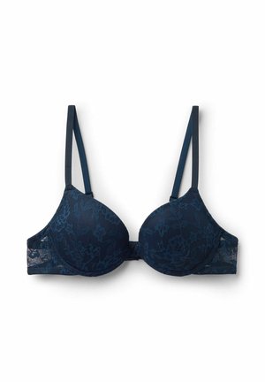 Marineblauer Spitzen-BH mit geformtem Körbchen, dünnen verstellbaren Trägern und floralen Musterdetails auf dem Stoff.