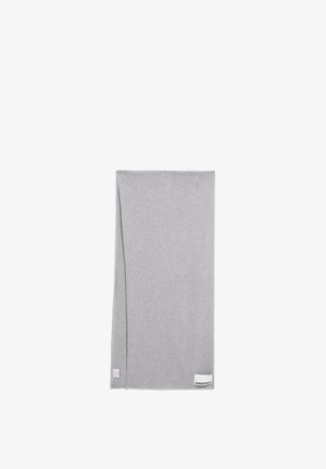 Gray, rectangular blanket made of soft fabric. Features a folded corner and a small label with brand name at one edge.