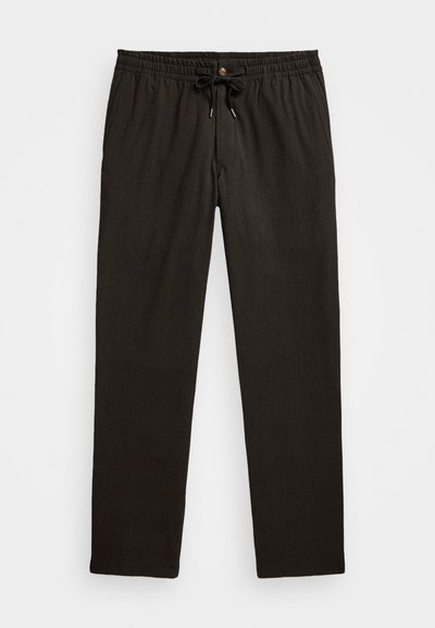 Tumši brūni bikses ar teksturētu rakstu, elastīga josta, aukliņa un viena pogas aizdare priekšā. Taisna kāju dizains.