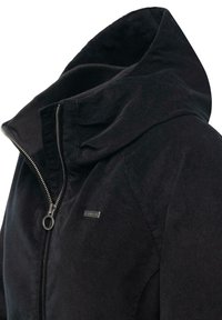 Black hooded jacket made of soft fabric, featuring a zip closure, textured collar, and a small logo on the front for branding.
