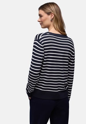 Marineblauer und weißer gestreifter Pullover mit Rundhalsausschnitt; weiches Material sowie gerippte Bündchen an Ärmeln und Saum; zeichnet sich durch eine lockere Passform und dezente Rücken-Nahtdetails aus.
