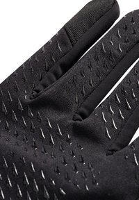 Gants noirs avec une surface texturée ornée de petits motifs triangulaires en relief, conçus pour la prise et la dextérité. Accents en tissu extensible.