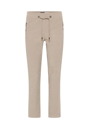 Pantalons beiges en tissu doux, dotés d'une taille élastique avec cordon de serrage, de poches latérales zippées et d'une coupe droite.