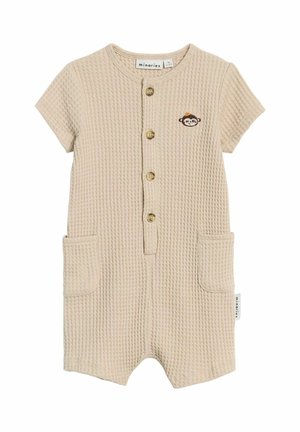Grenouillère bébé beige texturée à manches courtes, boutons sur le devant, deux poches et un petit visage de singe brodé sur la poitrine.