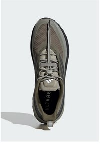Sneaker with a mesh and synthetic upper in olive and gray, features a textured toe box, lacing system, and a pull tab at the heel.